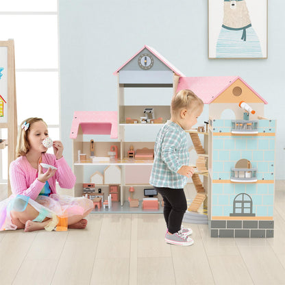 The wooden dollhouse next to a young girl having a tea party on the floor