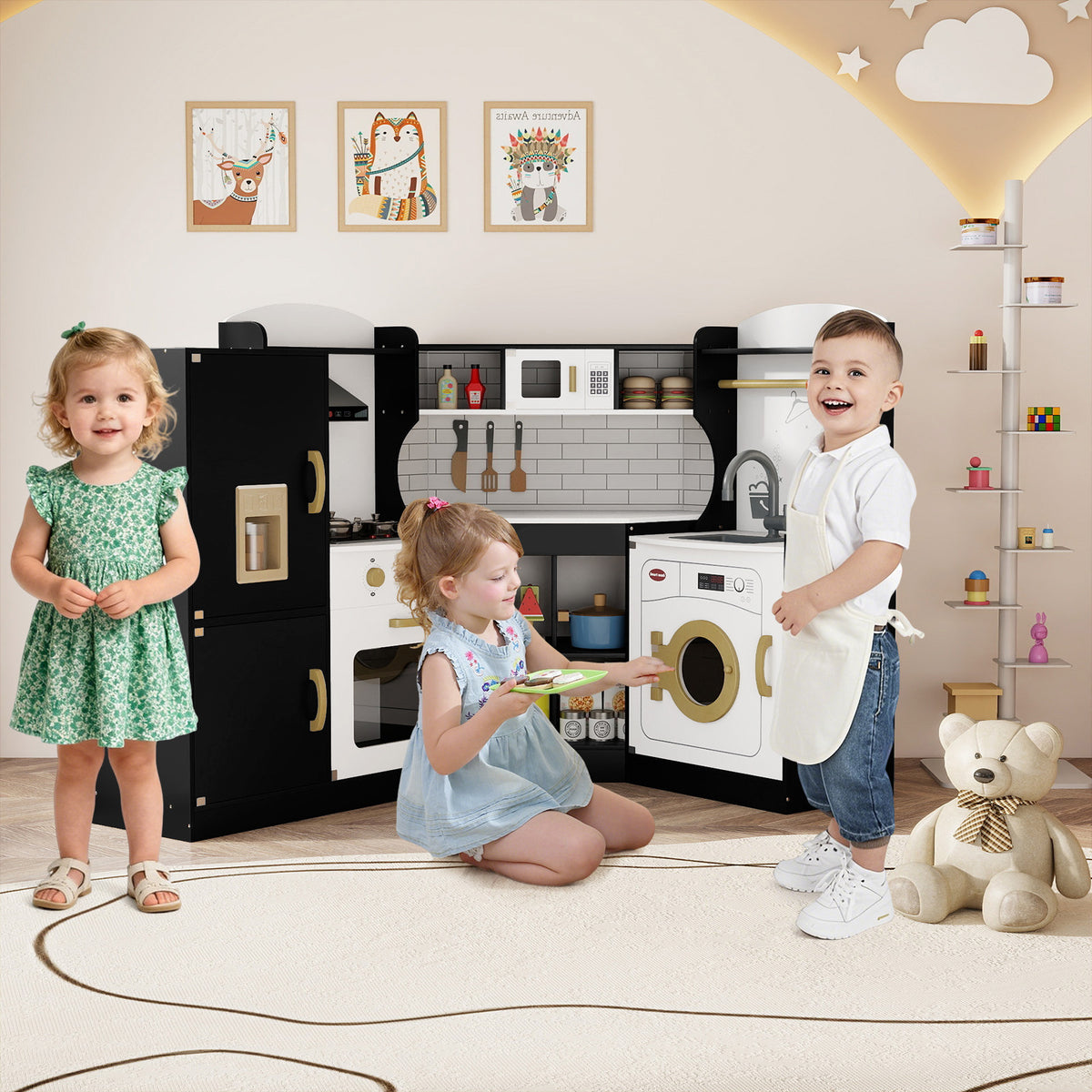 Two children playing with the black corner play kitchen set in a room with decorations