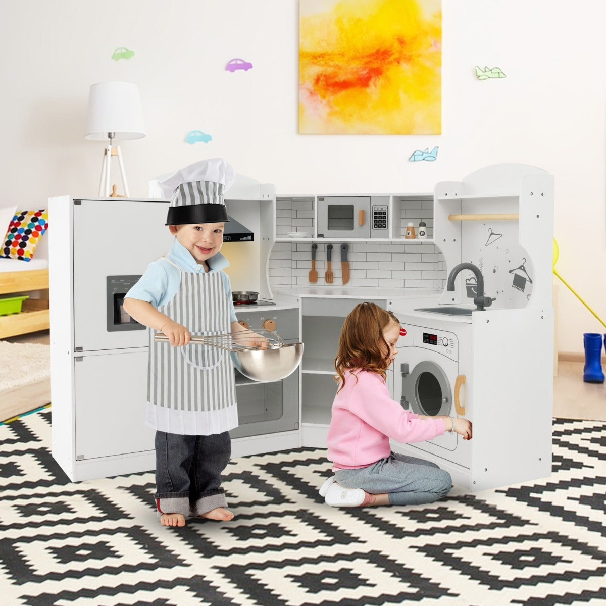 Two children playing with the wooden corner play kitchen set