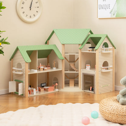 The wooden dollhouse with green roof has three storeys and open sides showing rooms and stairs