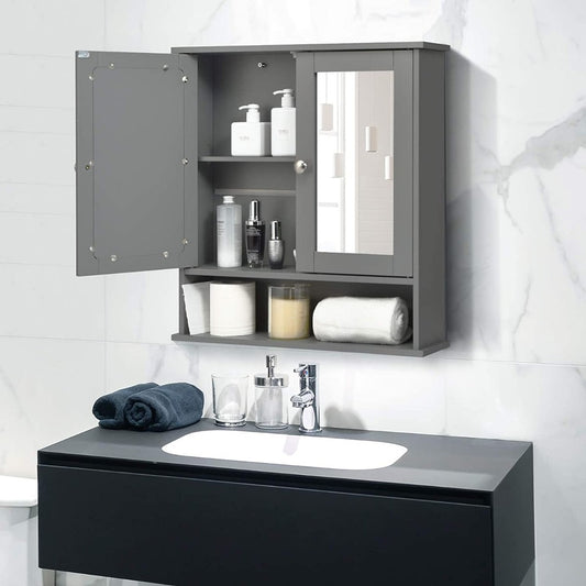 Grey wooden medicine cabinet with mirror hanging above a sink