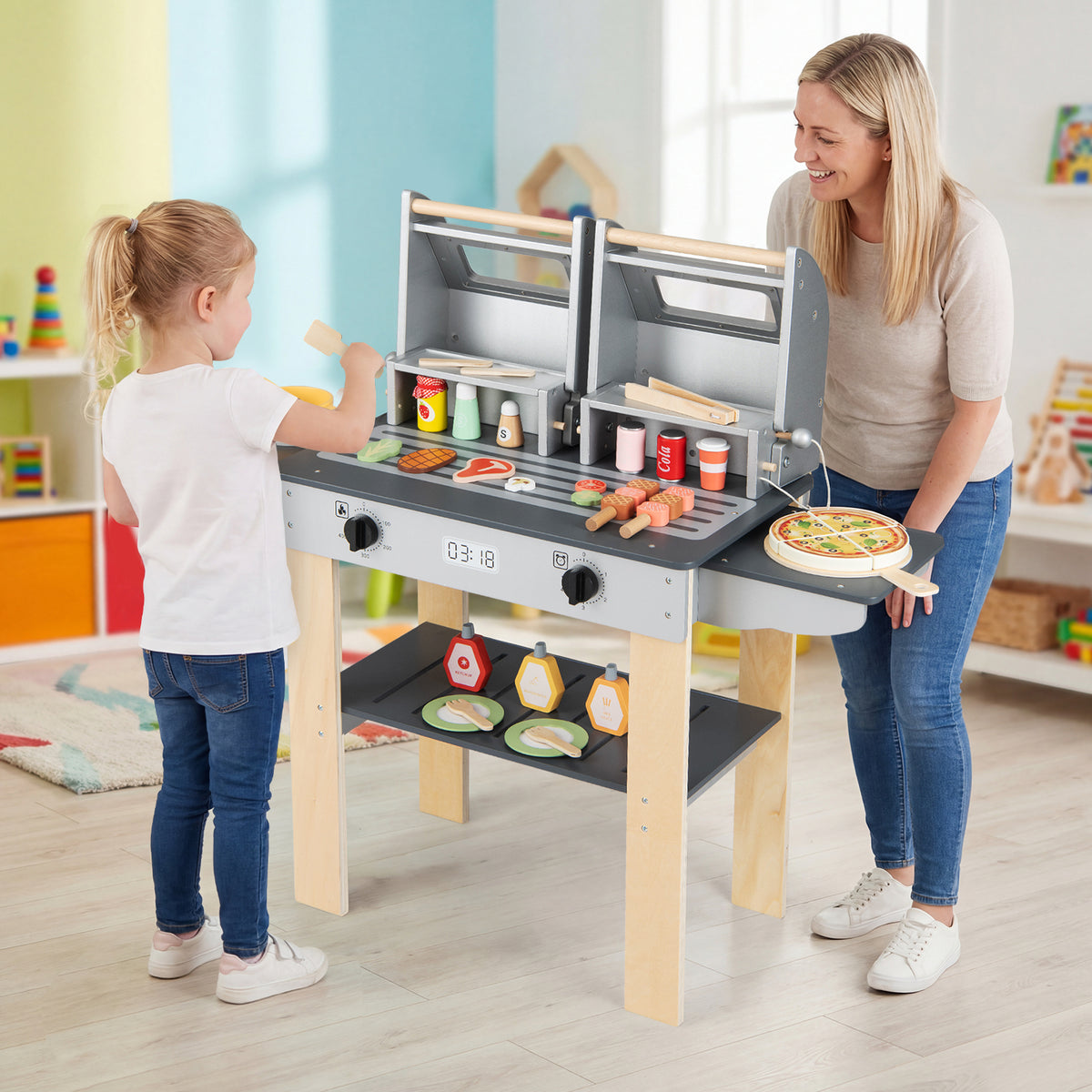 A mother and child playing with the wooden barbecue grill playset indoors