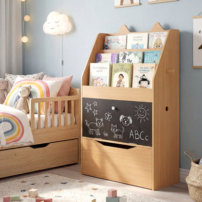The kids storage unit filled with books and decorated with chalk drawings in a nursery