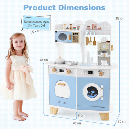 A young girl stands next to the blue and white play kitchen set with dimensions shown