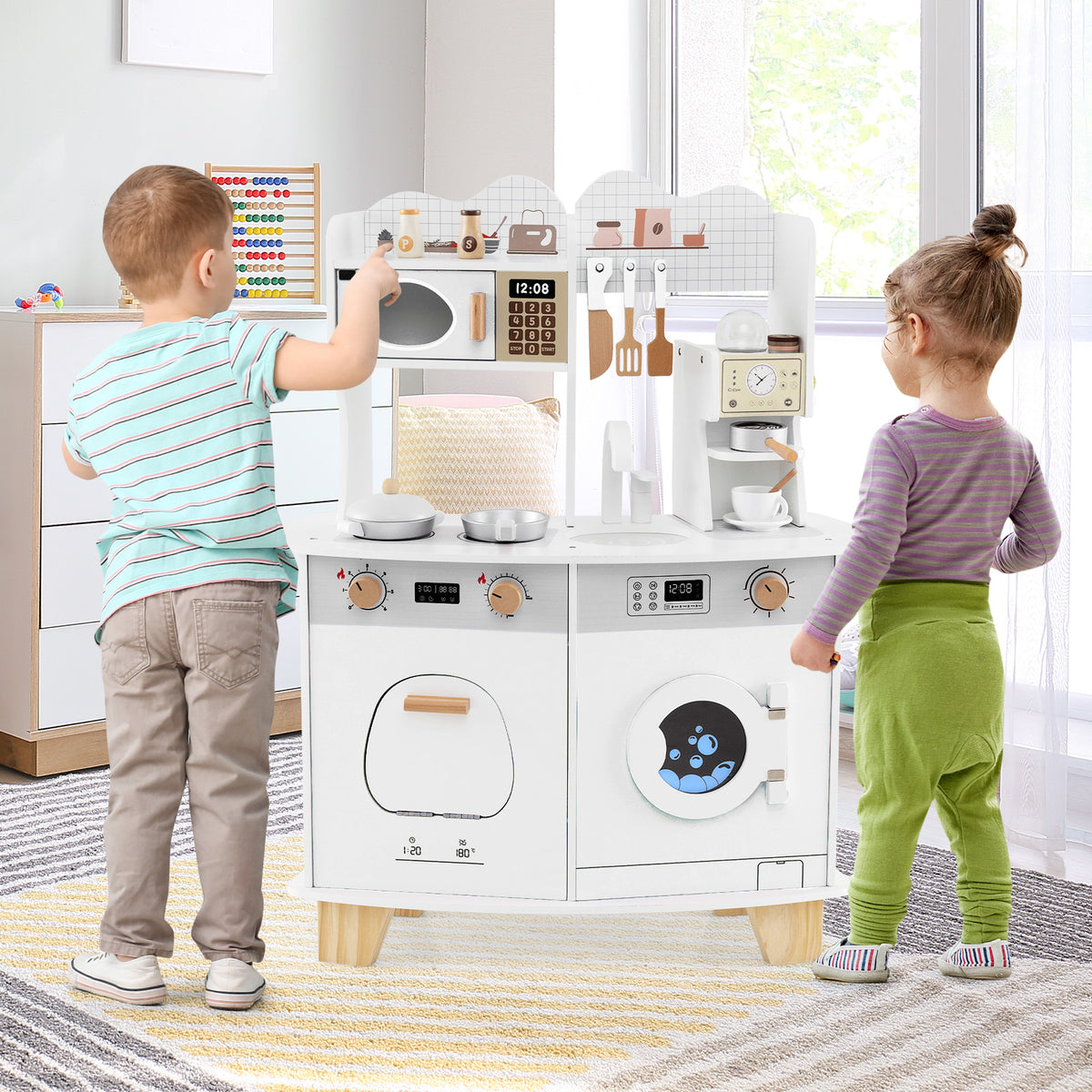 Two children playing with the wooden kids play kitchen set in a nursery