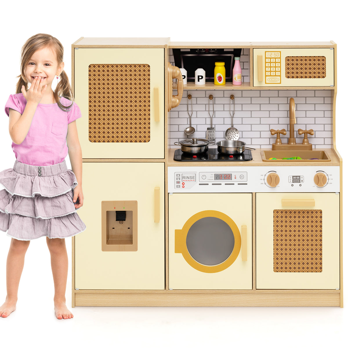 A young girl standing beside the wooden play kitchen set in a clean white studio environment
