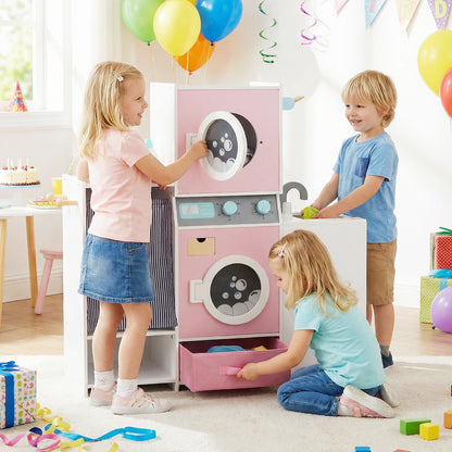 Children playing with the toy washing machine and laundry basket at a party