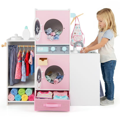 A girl playing with the toy washing machine and sink in a playroom