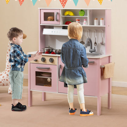 The play kitchen set being used by two children in a decorated room