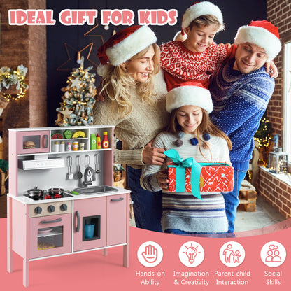 The play kitchen set displayed next to a family celebrating Christmas