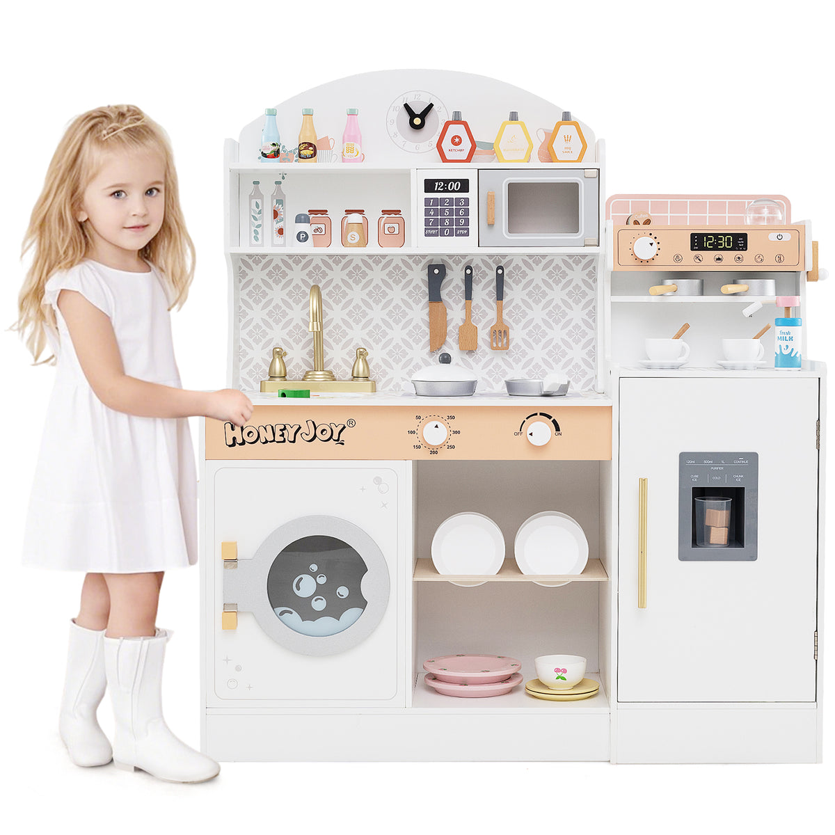 A young girl stands next to the white wooden kitchen playset with clock and microwave