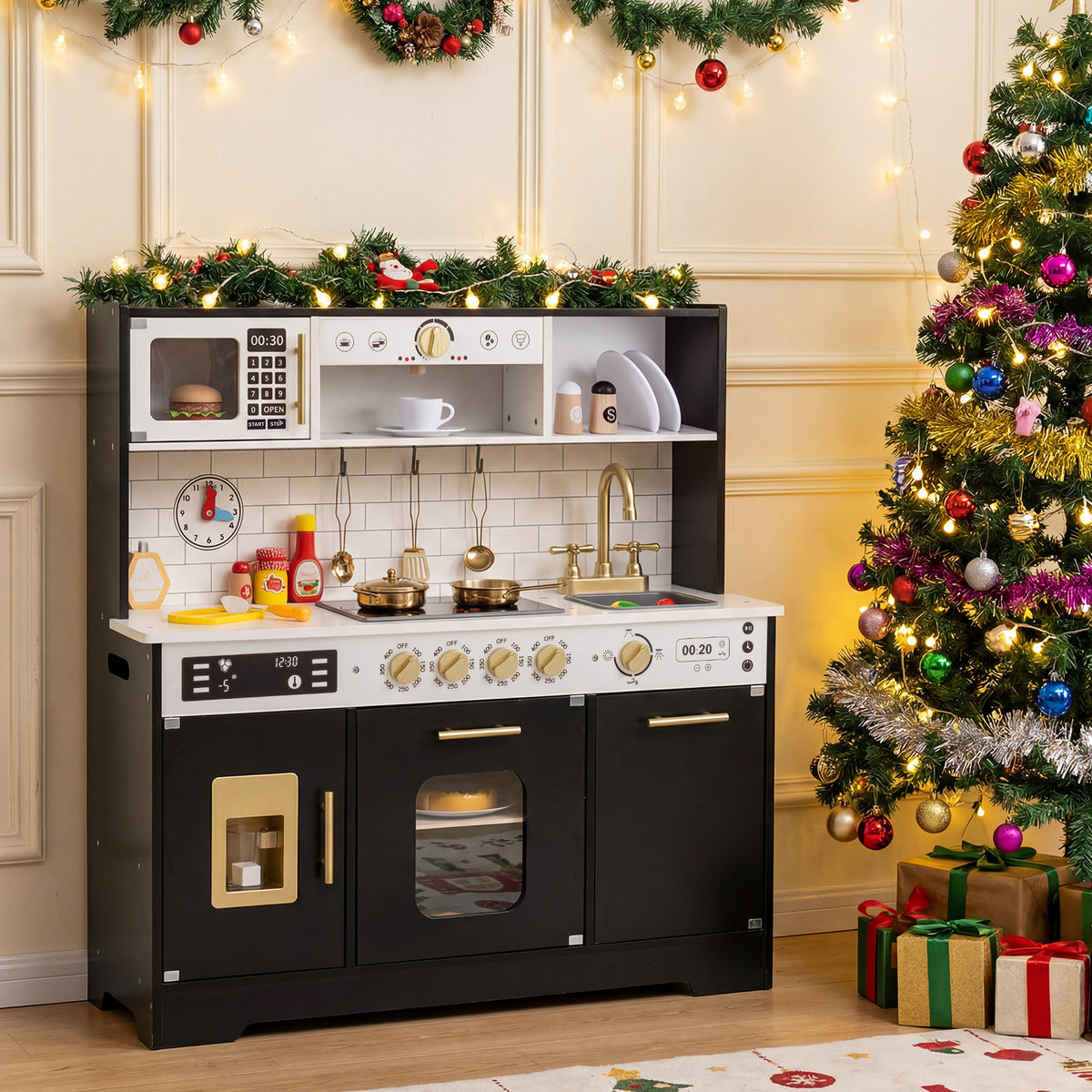 The black wooden play kitchen set is decorated for Christmas with a tree
