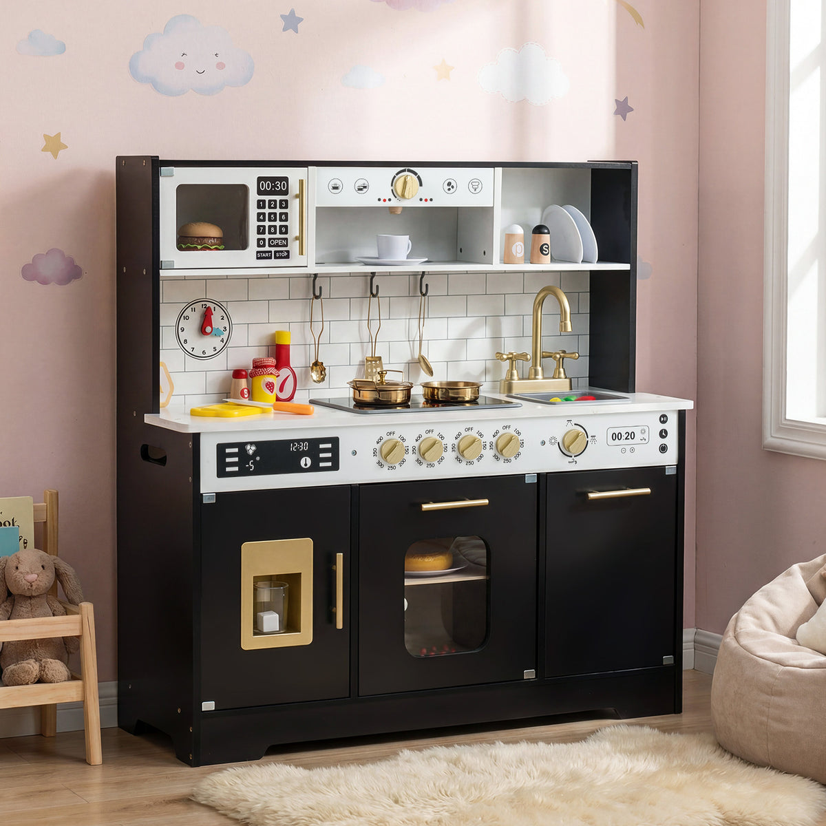 A black wooden play kitchen set is in a child's bedroom with toys around