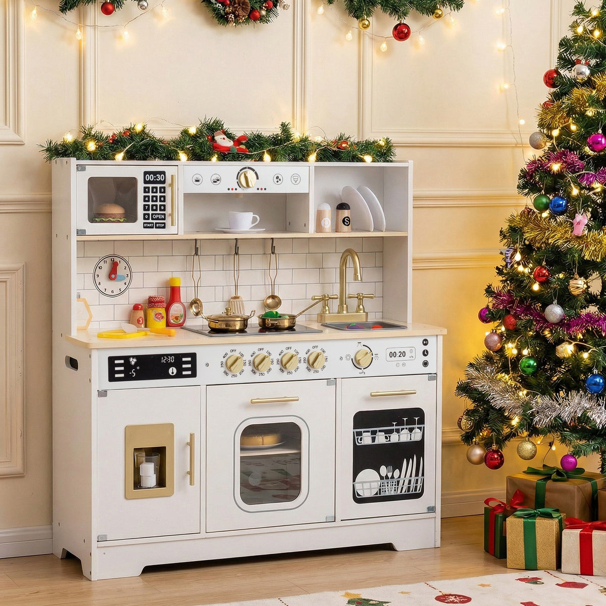 The white wooden kitchen playset decorated for Christmas with a tree and presents