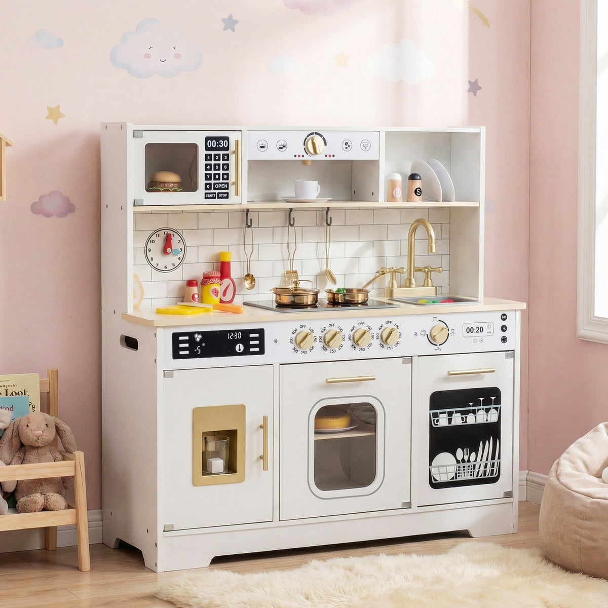 The white wooden kitchen playset in a child's bedroom with soft toys and a beanbag chair