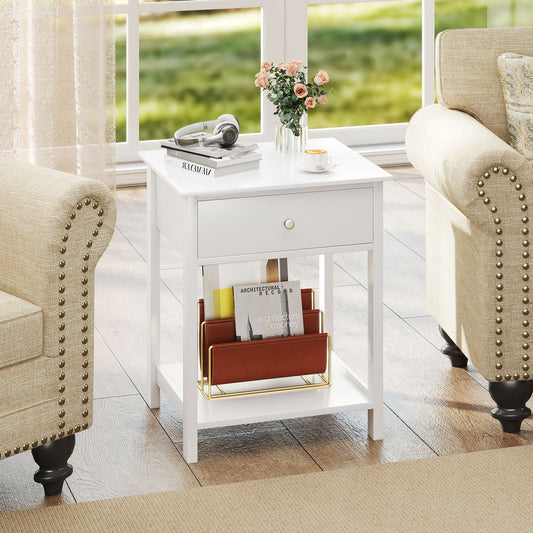 Wooden Nightstand with Drawer and Storage Shelf, the white bedside table in a living room setting next to a sofa, holding