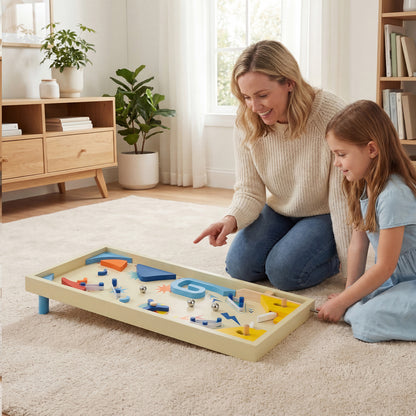 A woman and a girl sitting on a rug playing with the tabletop game together