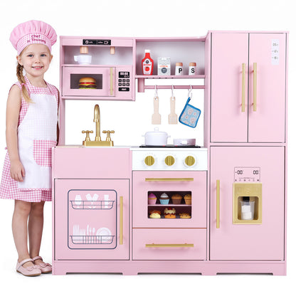 A young girl in a pink gingham dress and apron stands next to the pink play kitchen