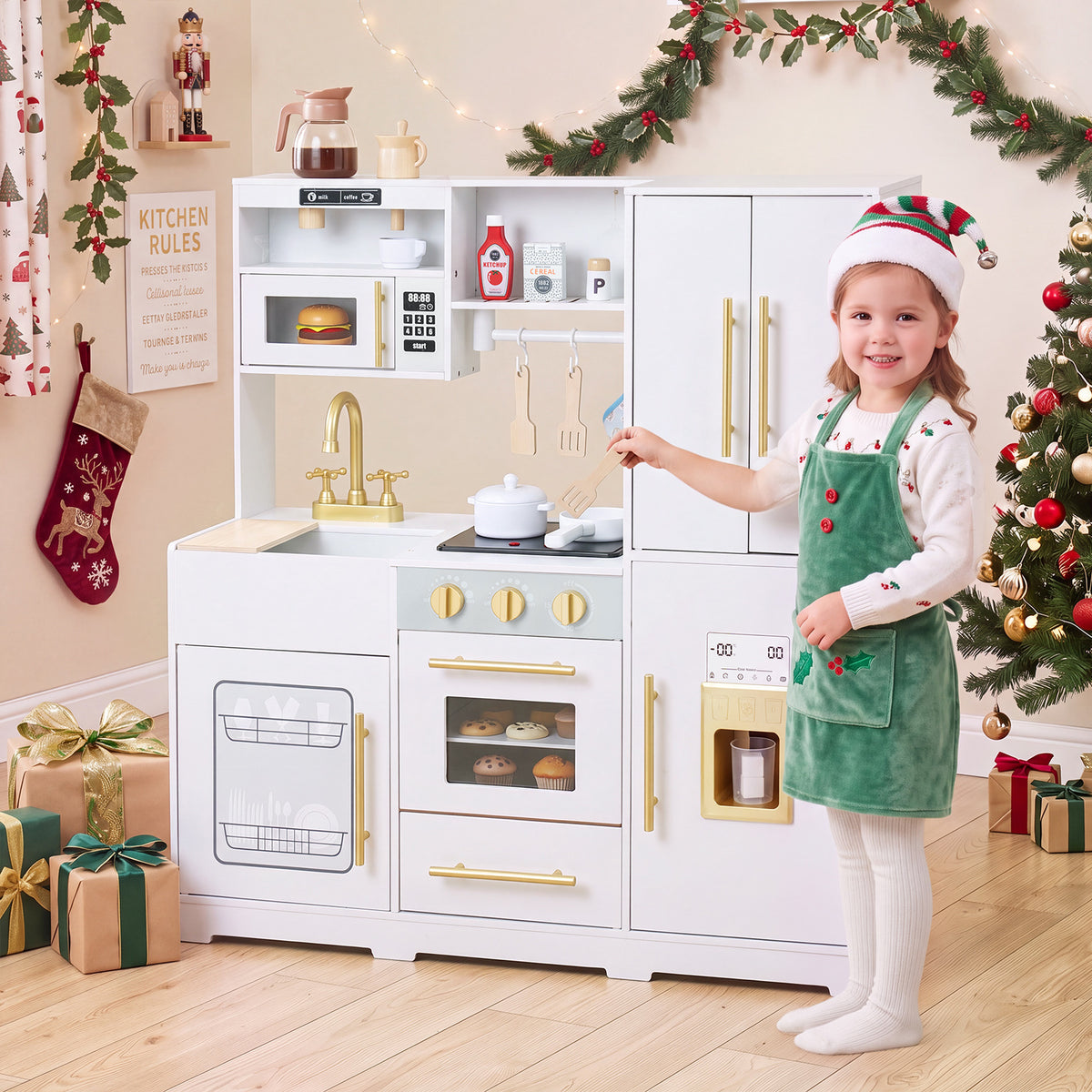 A young girl in a Santa hat plays with the white wooden play kitchen set at Christmas