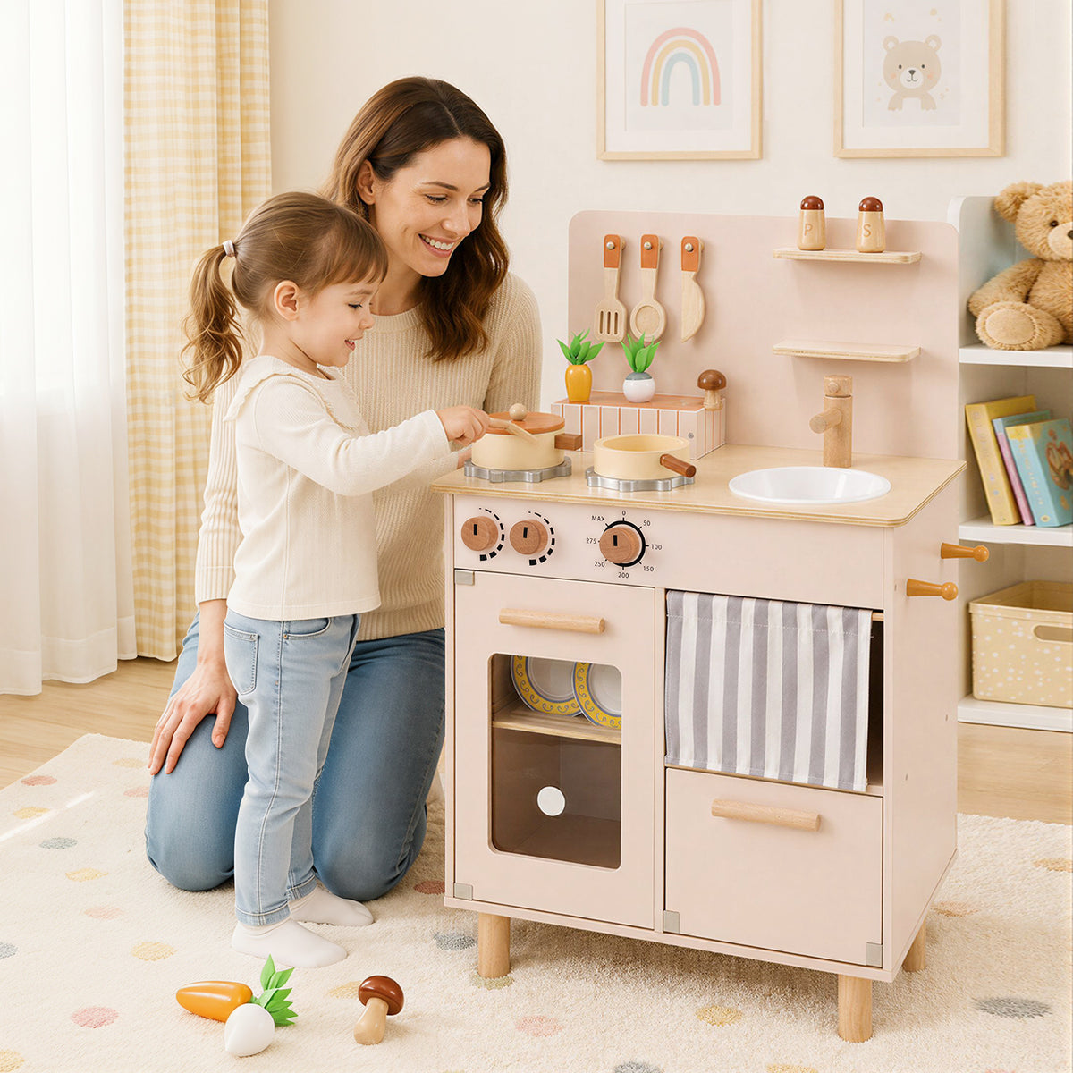 A mother and daughter playing together with the play kitchen set