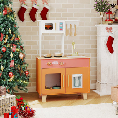 The wooden play kitchen set is shown in a festive room with a Christmas tree and presents