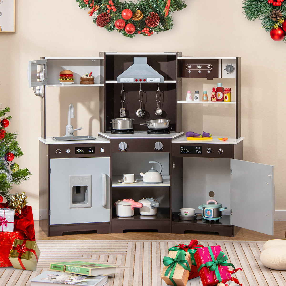 The play kitchen set placed in a living room decorated for Christmas with festive ornaments