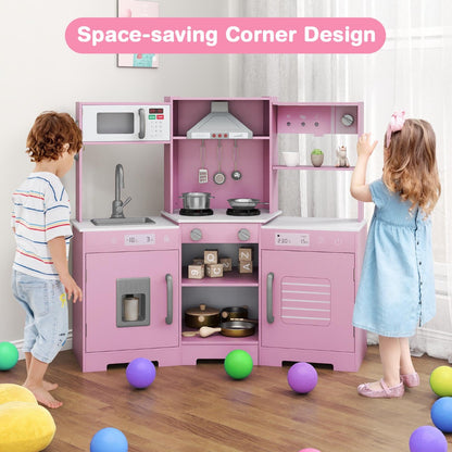 The play kitchen in a corner with a young boy and girl playing together in a bright room