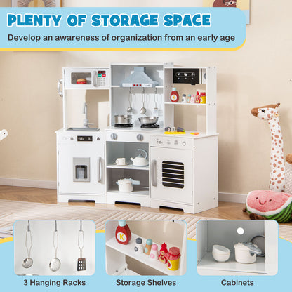 The white play kitchen has hanging racks, storage shelves and cabinets
