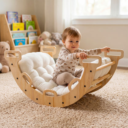 Baby sitting on the wooden climbing arch rocker in a cosy room