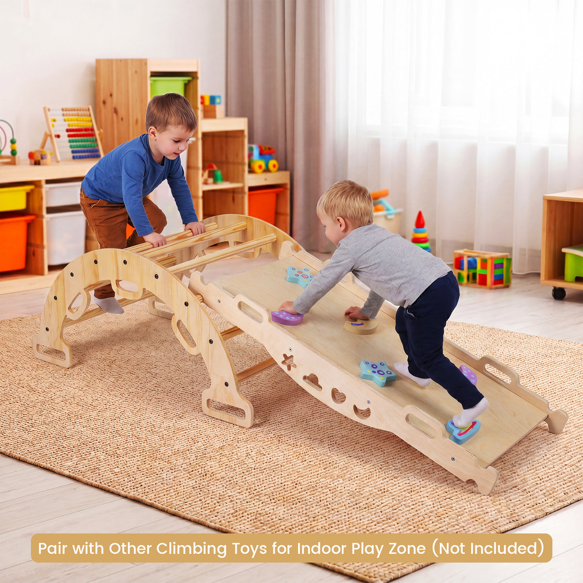 Two children playing on the wooden climbing frame in a playroom
