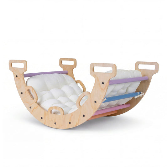 Wooden Rocking Climbing Arch with a soft white cushion placed inside for comfortable seating