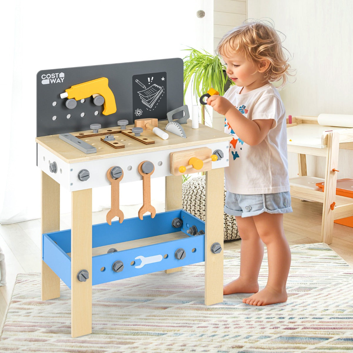 A young child playing with the wooden toddler workbench playset in a bright room