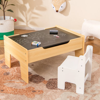 The wooden train table with the blackboard surface and a child's chair next to it