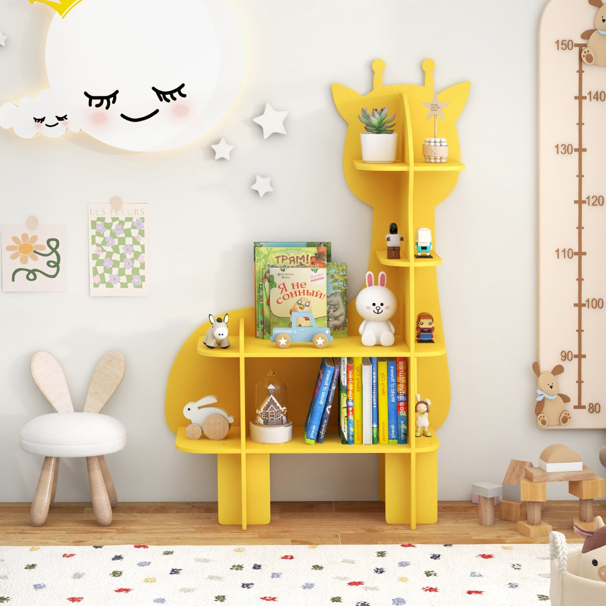 The yellow giraffe toy storage unit filled with books and toys in a nursery setting