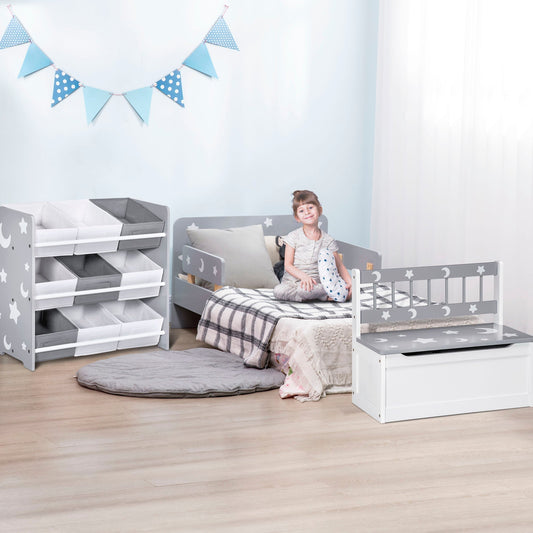 The kids bedroom set arranged in a room with a child sitting on the bed