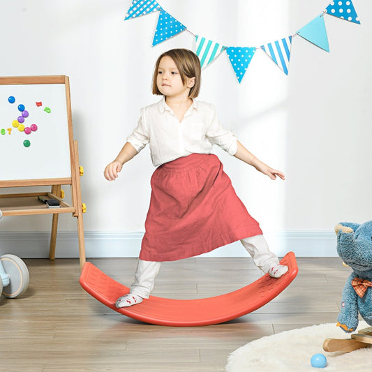 A young girl balancing on a red kids wobble board in a nursery room