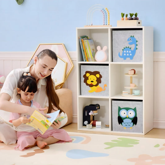 A white storage cabinet with three fabric drawers featuring animal designs, shown in a child's room