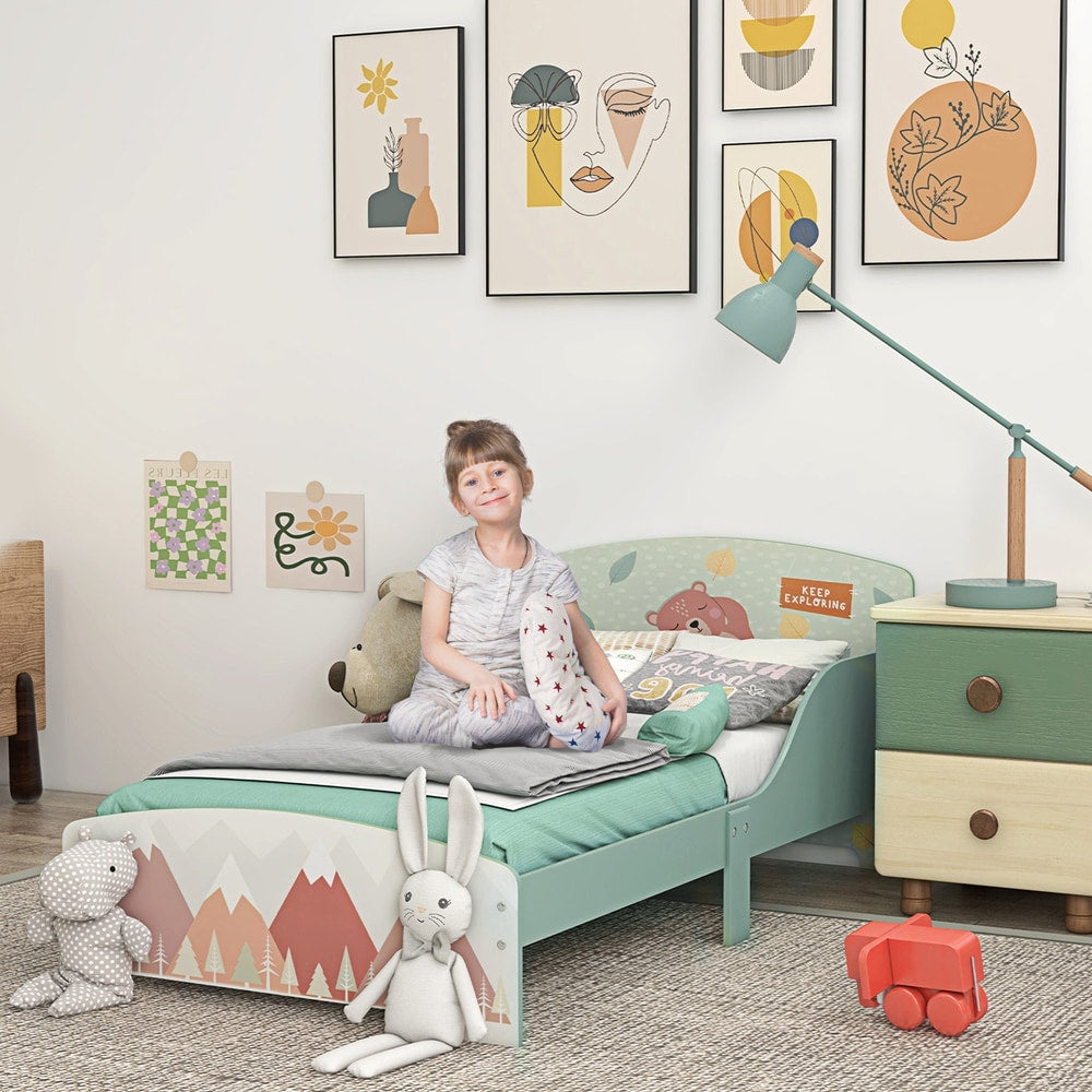 The kids bed styled in a child's bedroom with toys and a bedside lamp